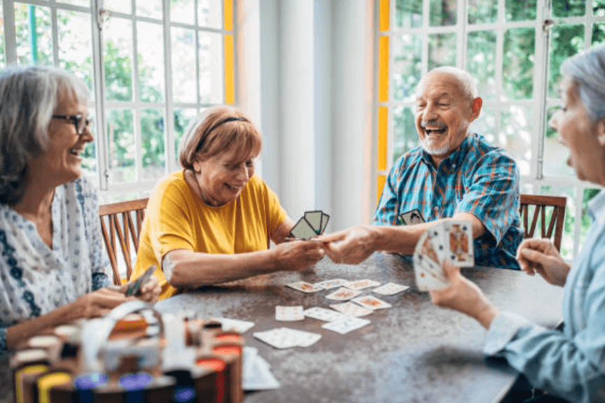 people playing a card game and laughing - thanksgiving activities for adults and kids